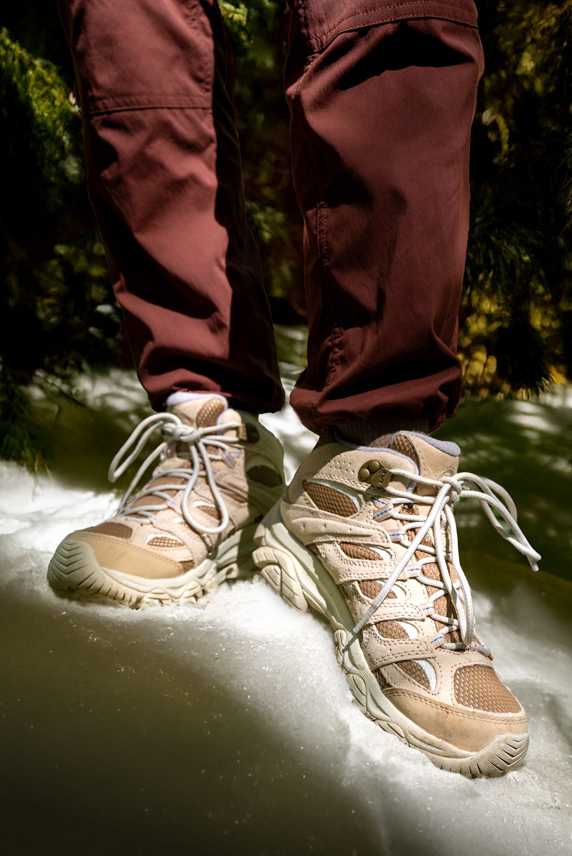 Man in woods wearing Merrell hiking boots